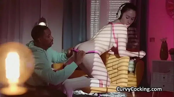 She likes videogames while riding a big black cock